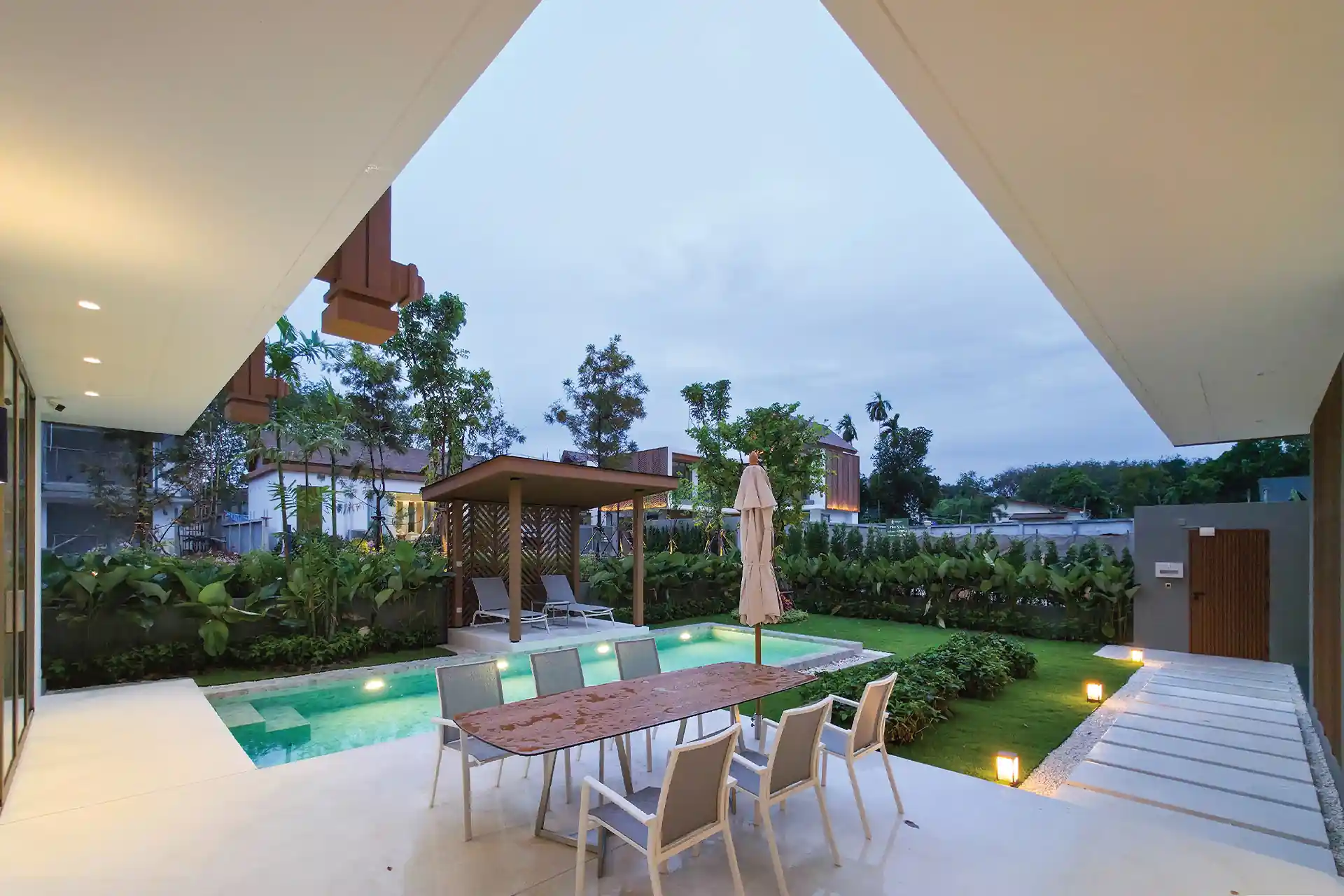 Serene Raya Bangjo covered outdoor dining terrace beside private swimming pool