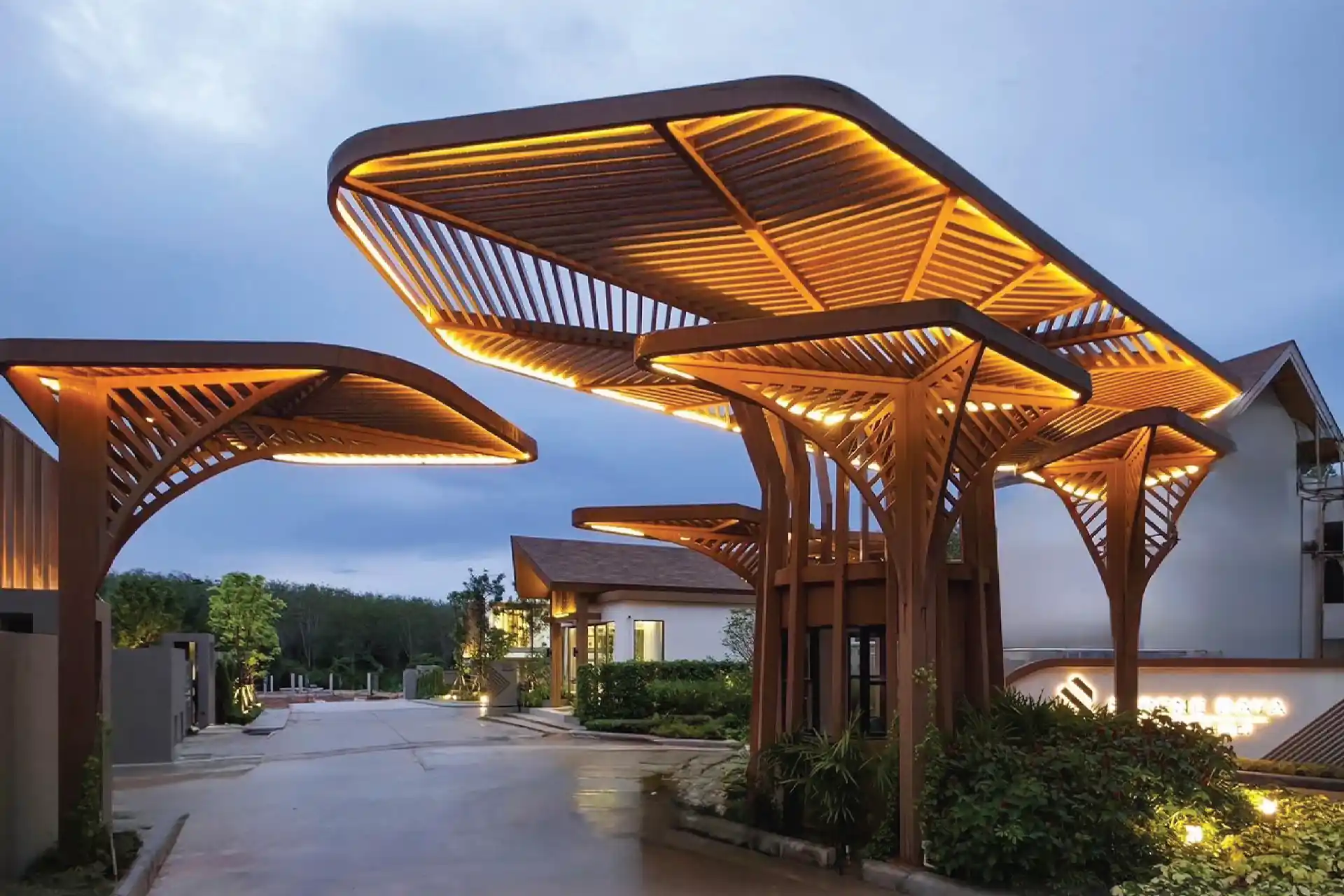 Serene Raya Bangjo signature entrance gate with sculptural canopy and warm lights