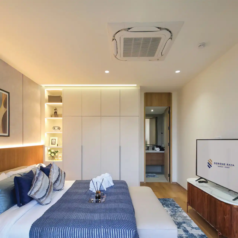 Serene Raya Bangjo stylish upstairs bedroom with blue accents and ensuite