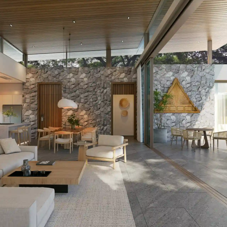 Mono Champaca Pool Villas open living and dining with stone wall