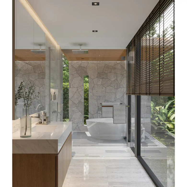 The Baya bathroom with freestanding bathtub and stone feature wall