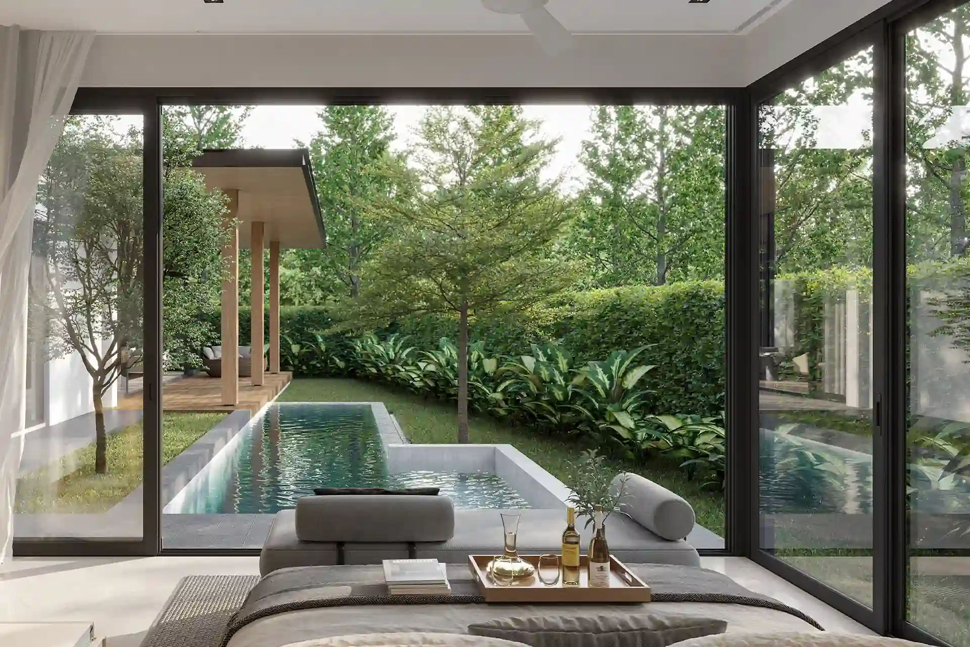 The Baya bedroom with floor-to-ceiling glass and pool view
