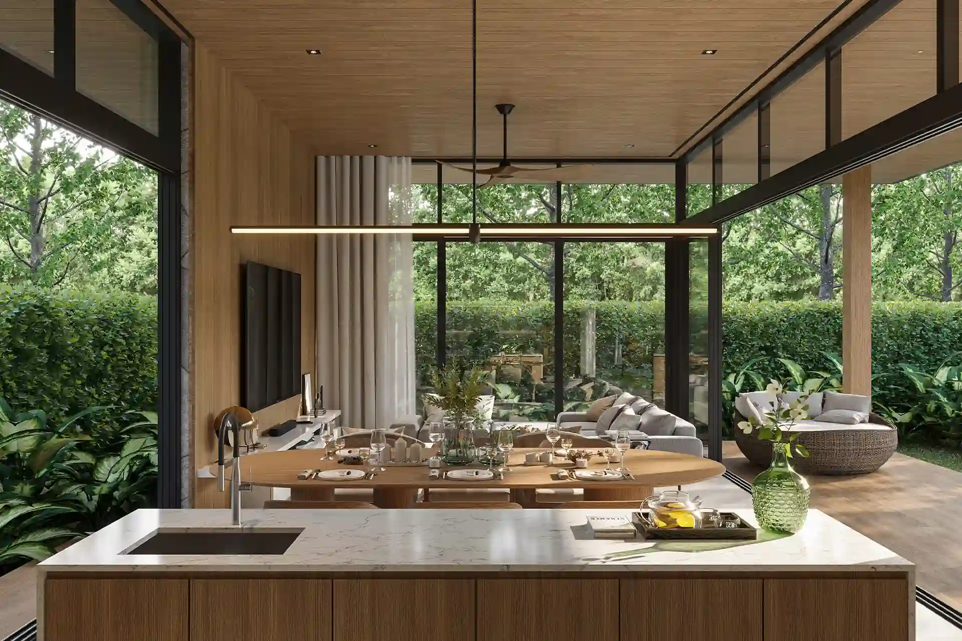 The Baya kitchen island and dining area with garden views