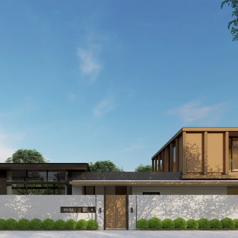 The Baya villa entrance facade with private gate and greenery