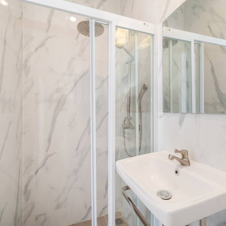 Goldena Twin Kamala bathroom with shower cabin and vanity sink
