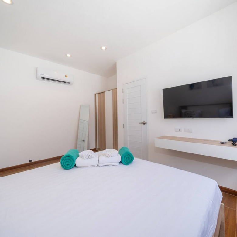 Goldena Twin Kamala bedroom with TV console and minimalist design