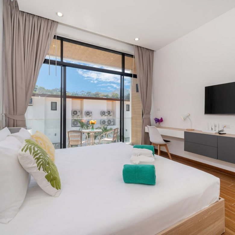 Goldena Twin Kamala bedroom with TV console and balcony seating