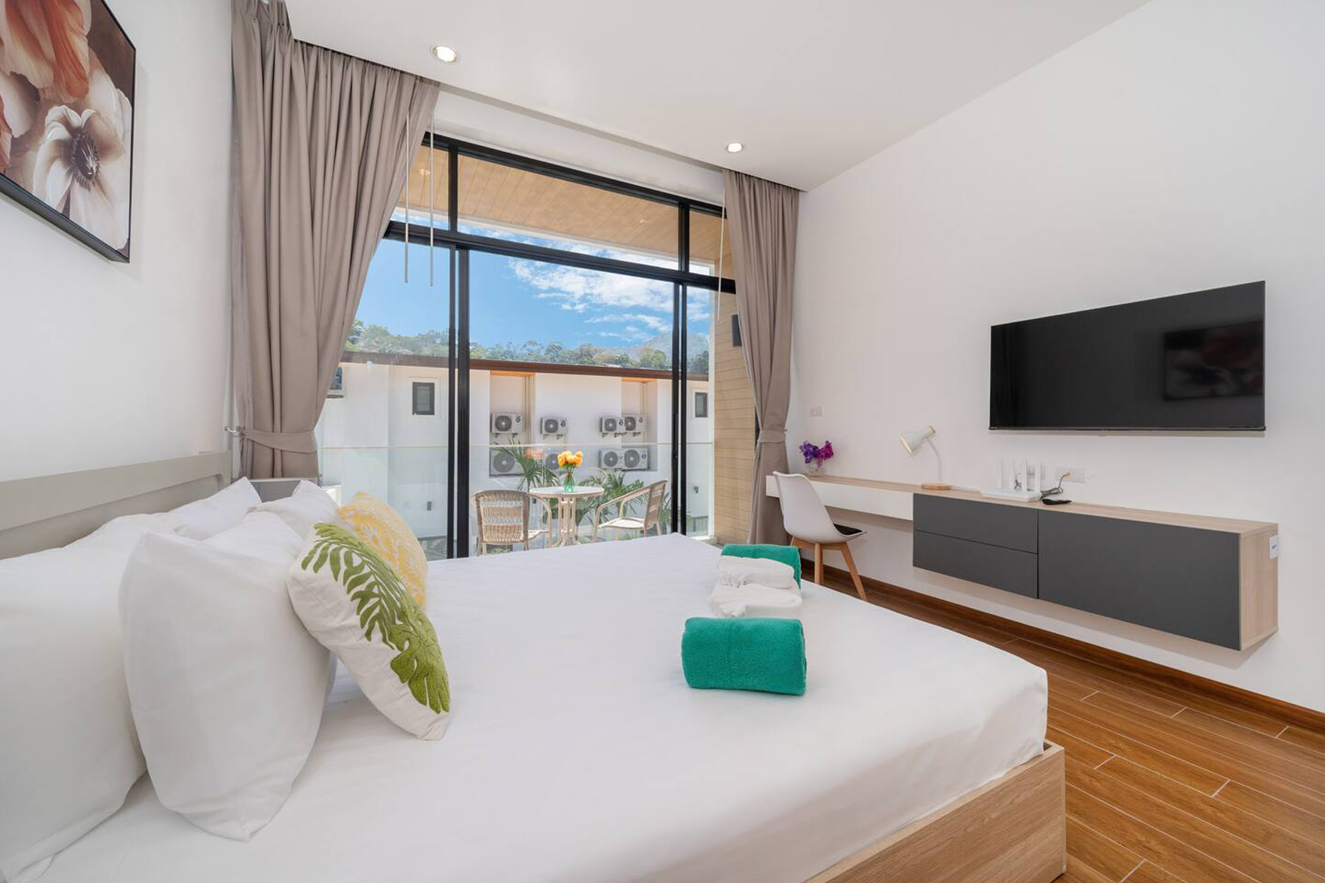 Goldena Twin Kamala bedroom with TV console and balcony seating