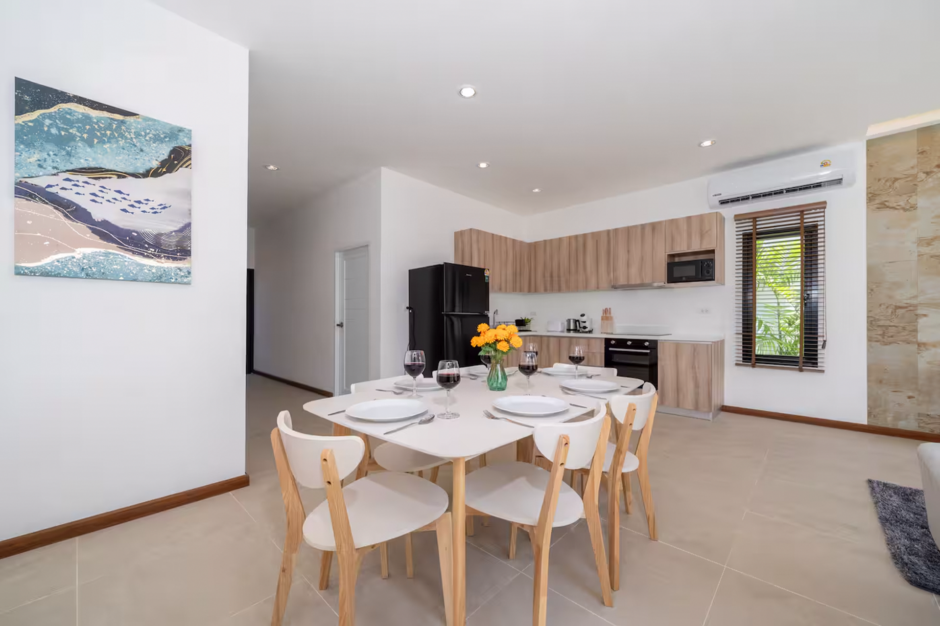 Goldena Twin Kamala dining table set beside modern open kitchen