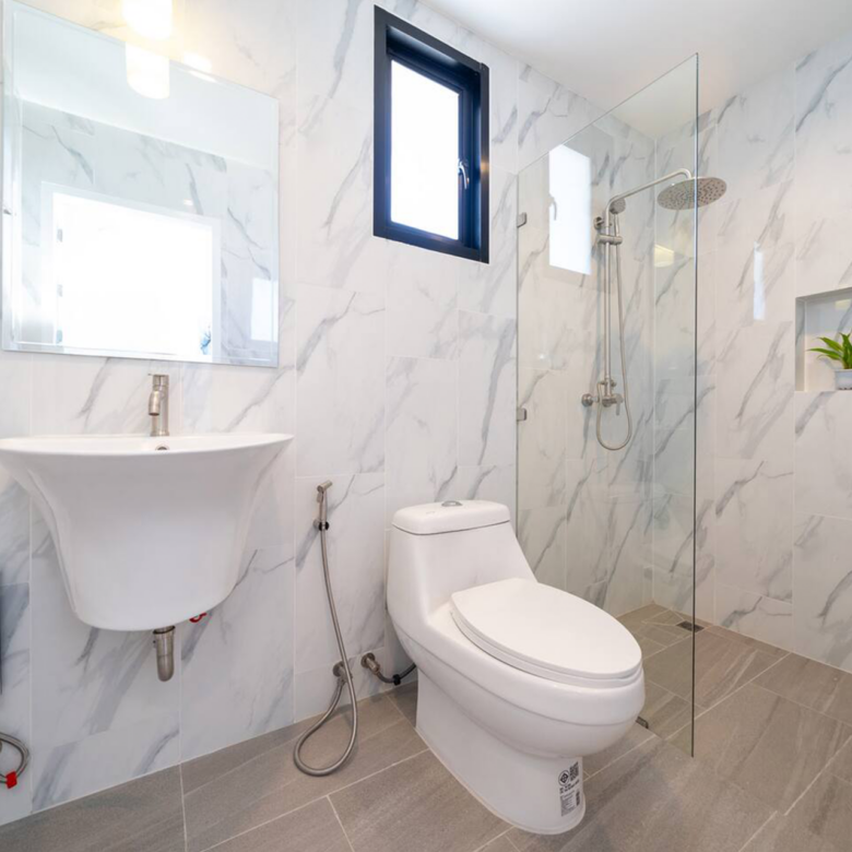 Goldena Twin Kamala ensuite bathroom with shower and marble-look tiles