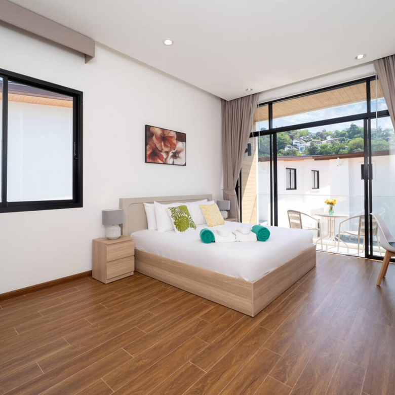 Goldena Twin Kamala master bedroom with balcony and hill views