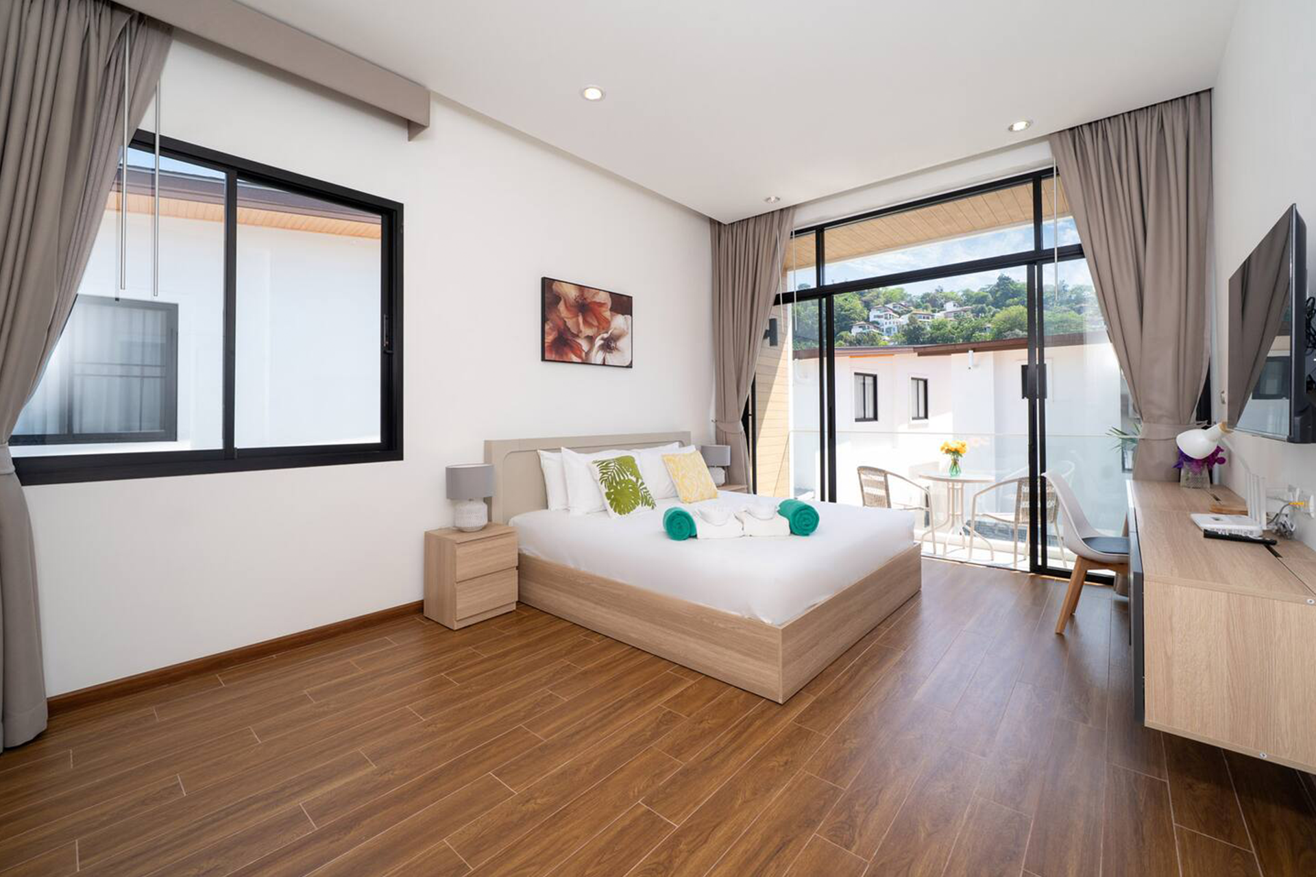 Goldena Twin Kamala master bedroom with balcony and hill views