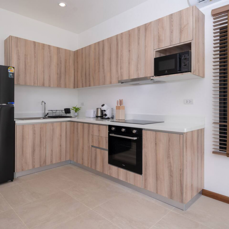 Goldena Twin Kamala modern kitchen with built-in oven and cabinets