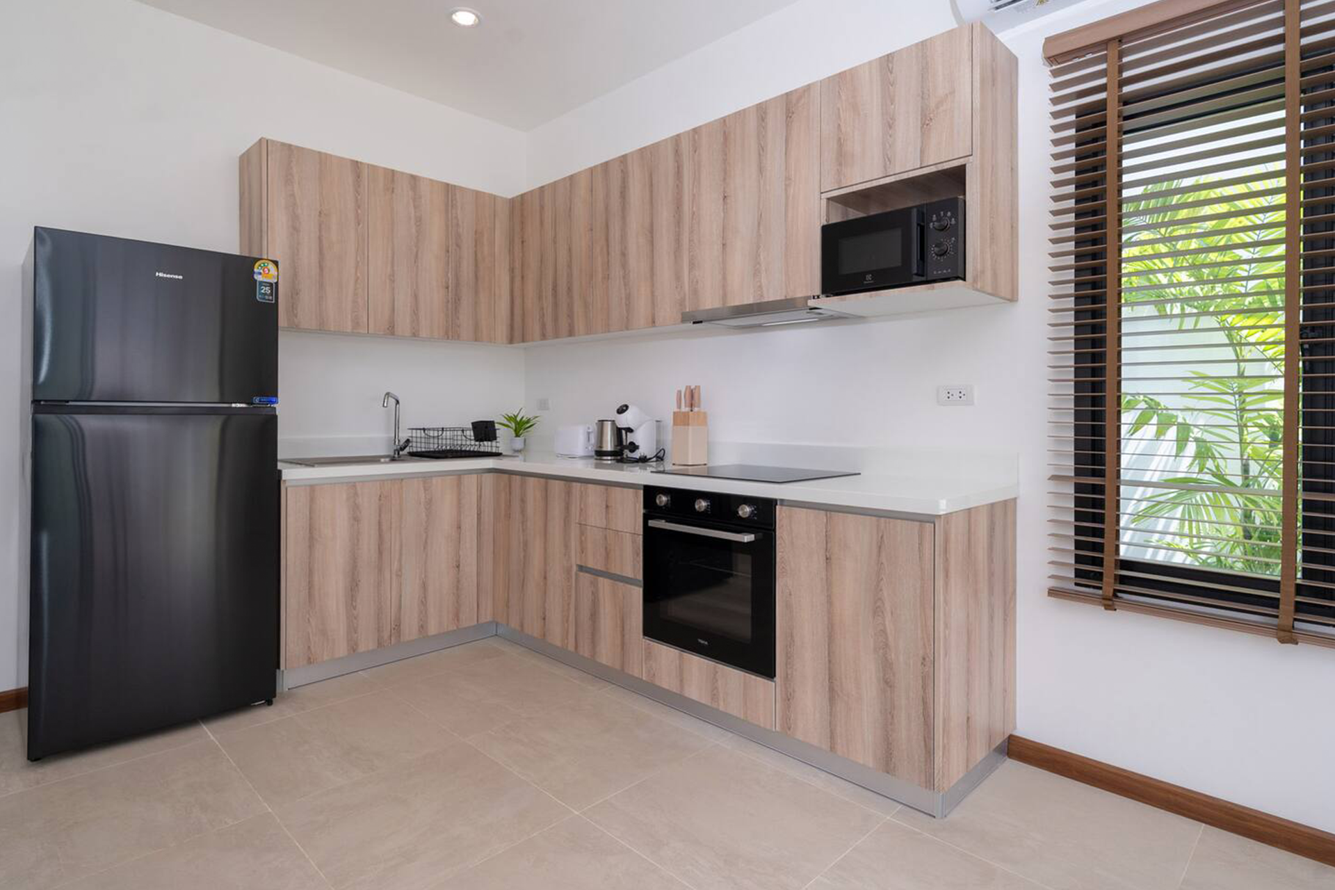 Goldena Twin Kamala modern kitchen with built-in oven and cabinets