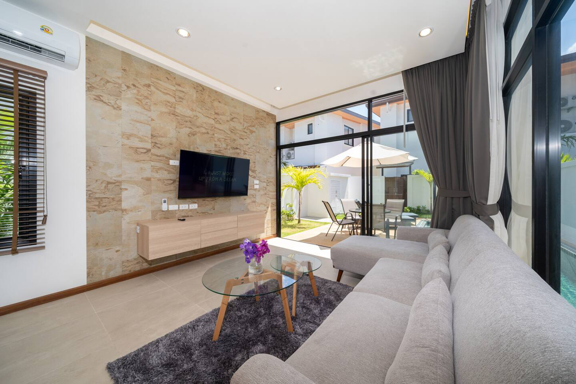 Goldena Twin Kamala modern lounge with large sliding glass doors