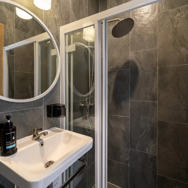 Goldena City Gems Kamala compact bathroom with sink and shower