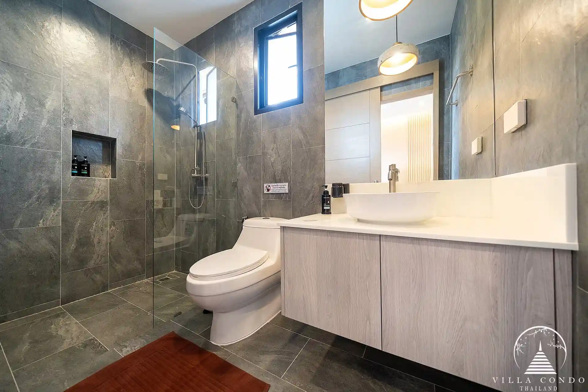Goldena City Gems Kamala bathroom with walk-in shower and vanity