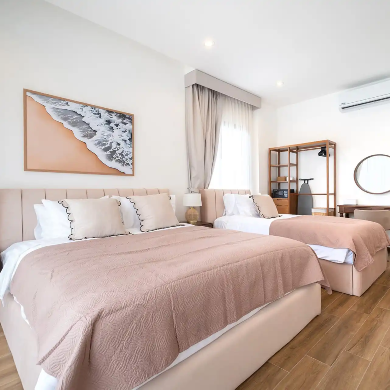 Goldena City Gems Kamala bedroom with extra bed and desk