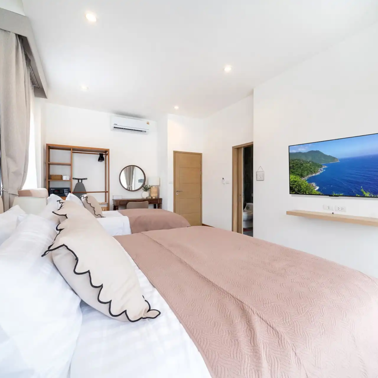 Goldena City Gems Kamala bedroom with TV and twin beds