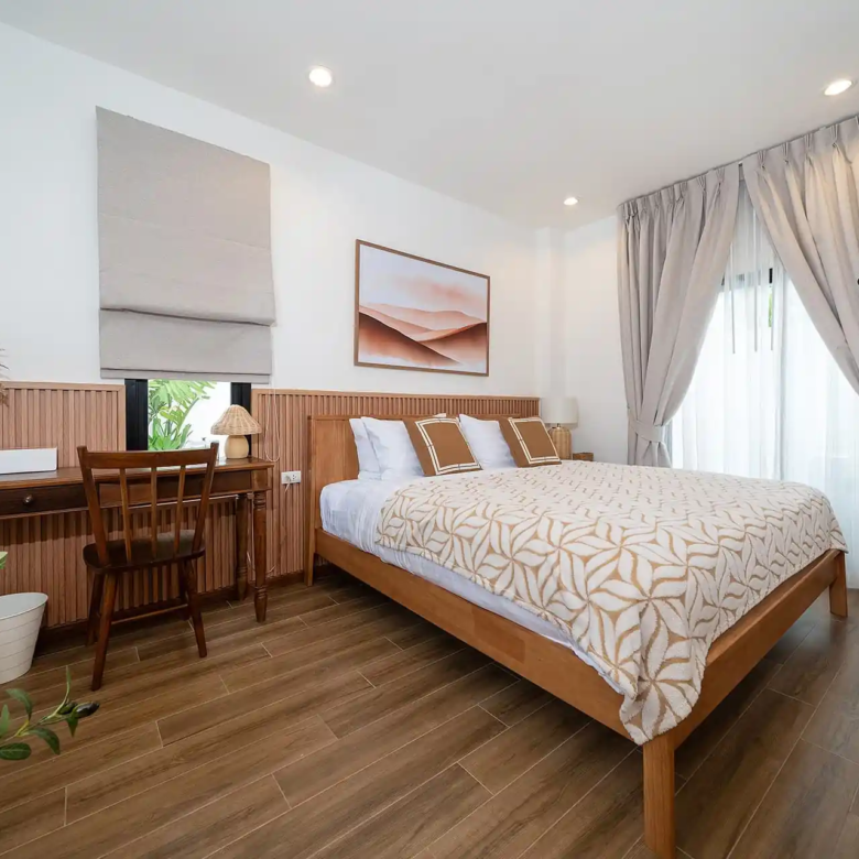 Goldena City Gems Kamala bedroom with wood headboard and desk