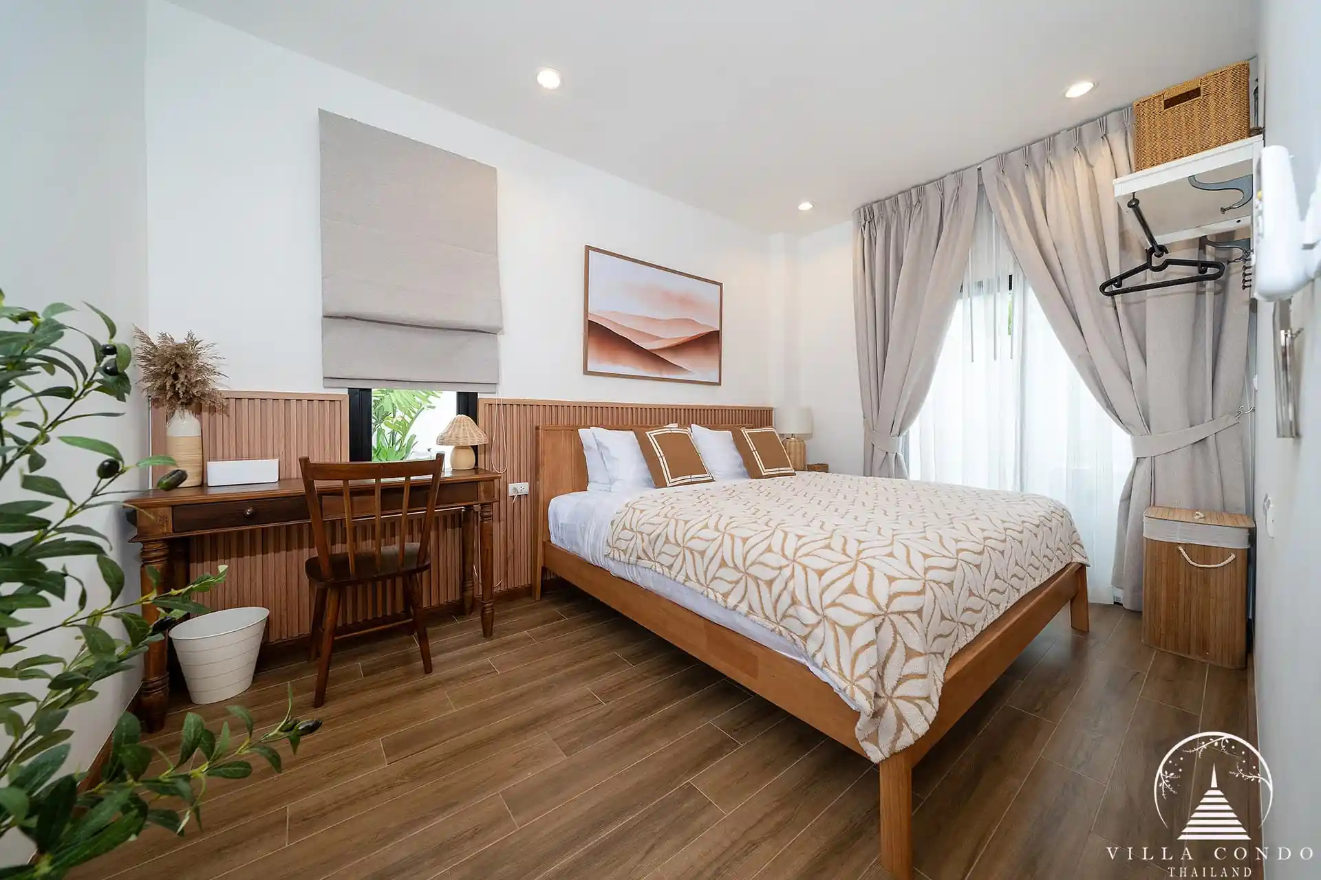 Goldena City Gems Kamala bedroom with wood headboard and desk