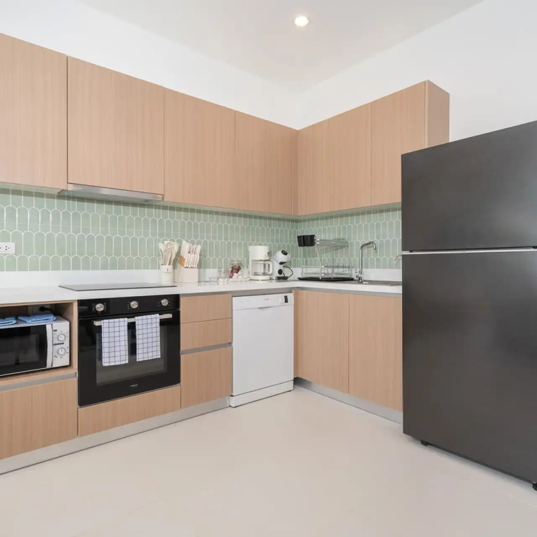Goldena City Gems Kamala kitchen counter with storage and appliances
