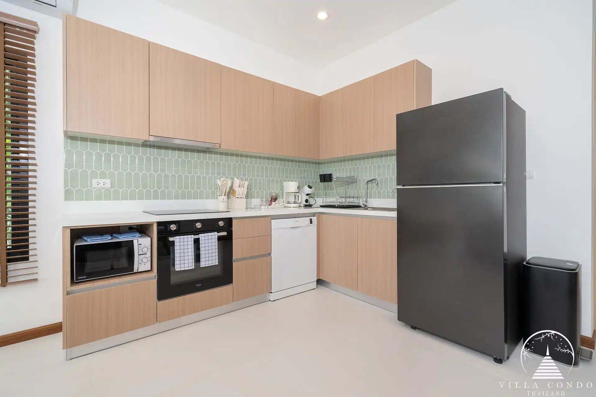Goldena City Gems Kamala kitchen counter with storage and appliances